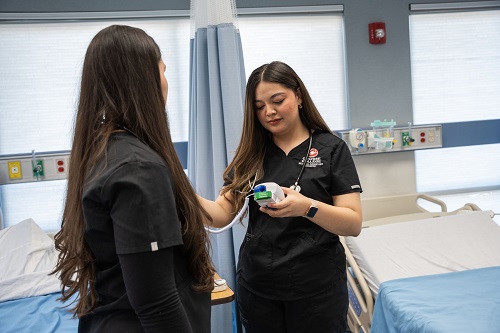 medical assistant holding a bag of blood