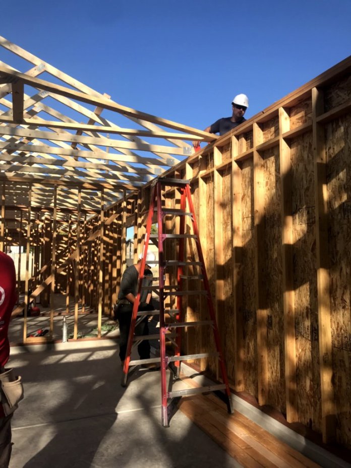 students building a house