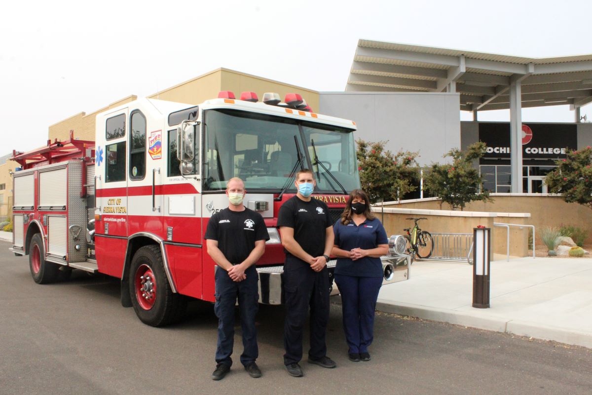 fire science students in front of a fire truck