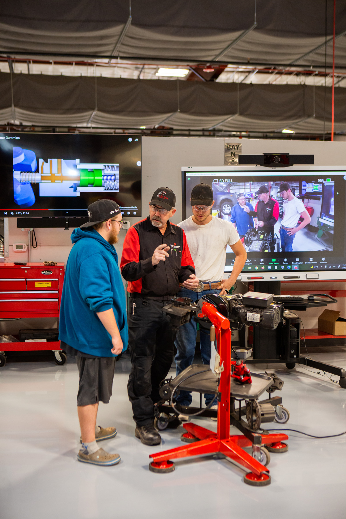 Two Automotive Students with their Instructor