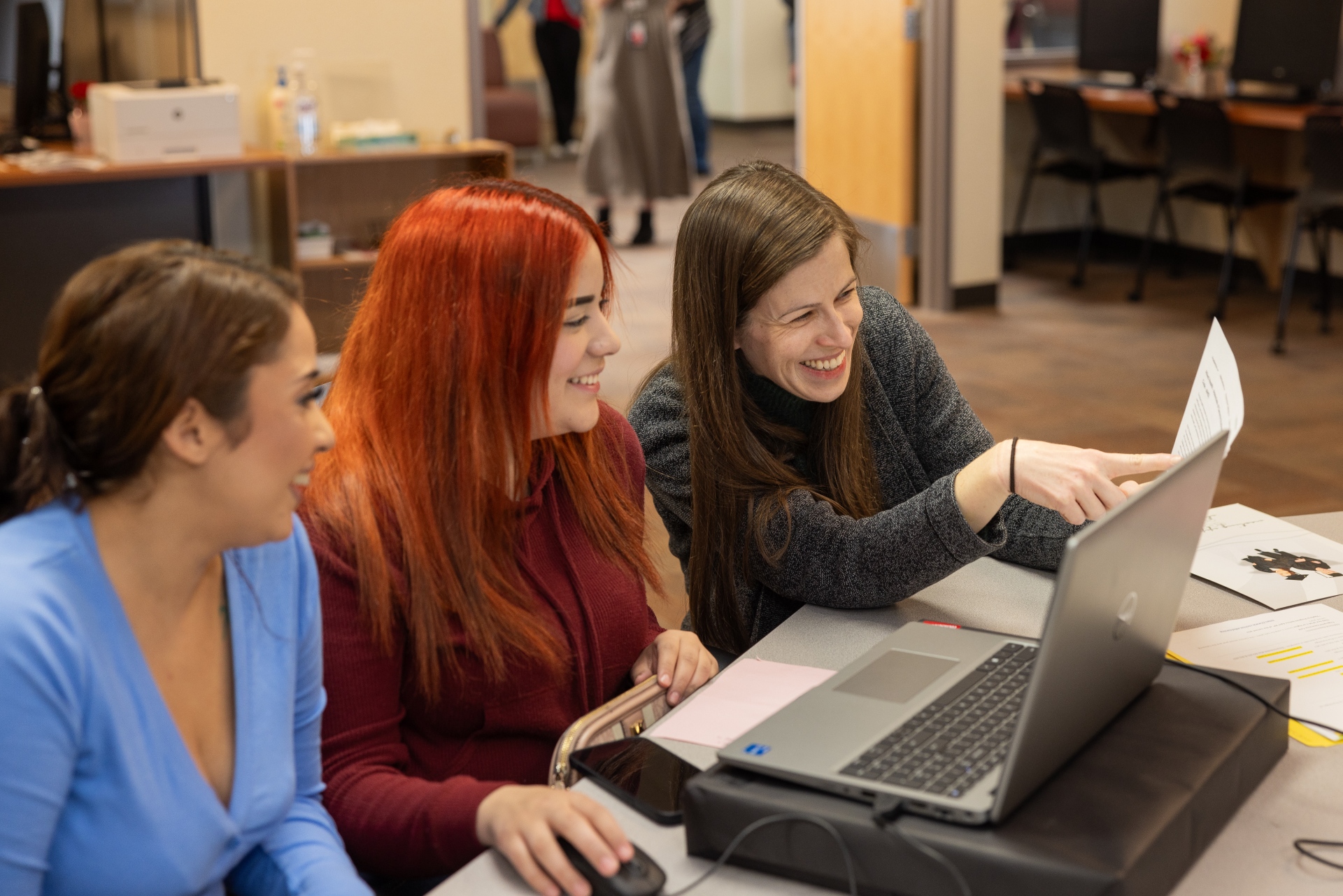 two female students and an advisor