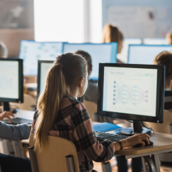 girl looking at computer