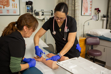 Nursing students practicing blood draws