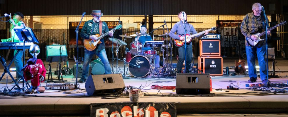 Band playing on stage at the 2024 Pit Fire Pottery Festival.