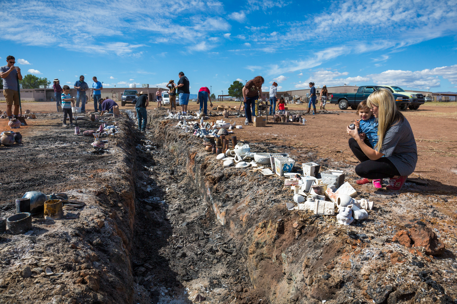 Volunteers removing ceramic from pit the next day